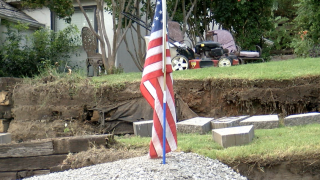 Vietnam  vet's American  flag in hill of gravel