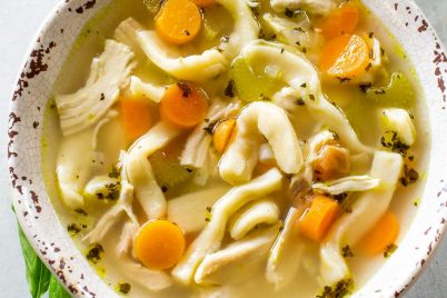 Homemade Chicken Noodle Soup - tried and true comfort food. A recipe for homemade noodles too but you can use store bought as well. the-girl-who-ate-everything.com